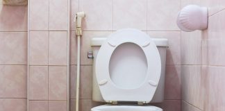 The reason doors in public bathrooms don’t touch the ground